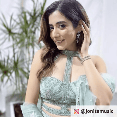 Jonita Gandhi wearing Earrings from Mallika Necklace Set from Blingvine