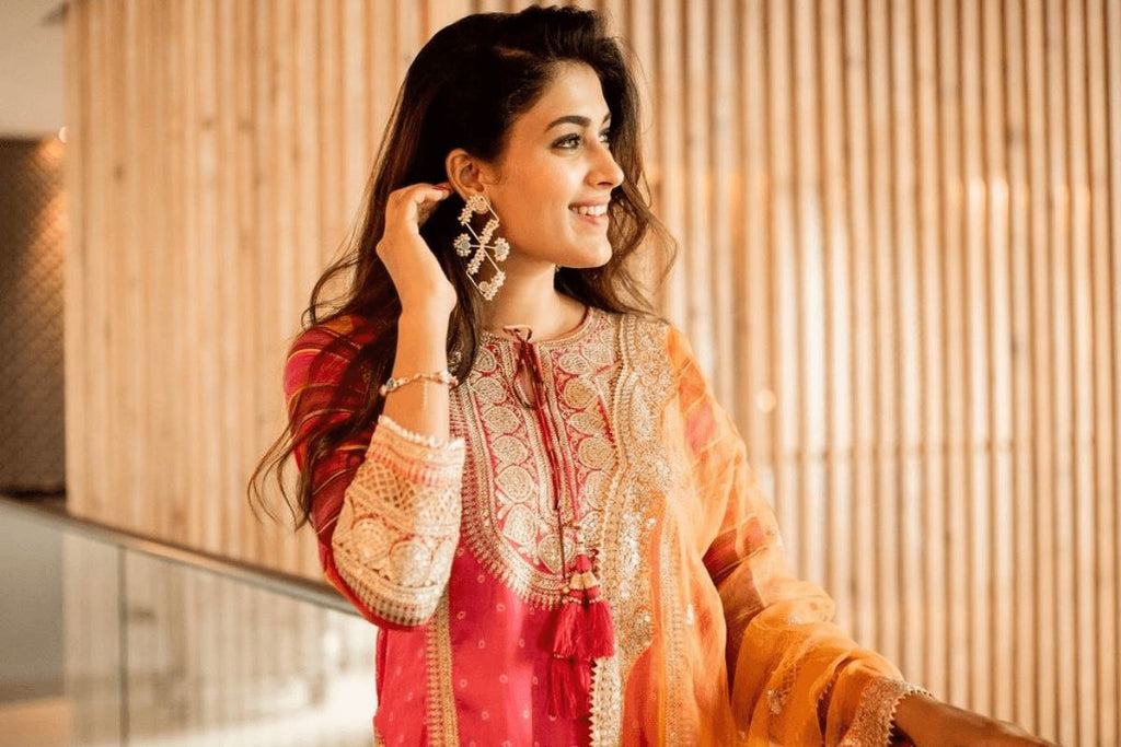Close up of smiling woman in black salwar suit with hand on hips. Front pose  Stock Photo | Adobe Stock